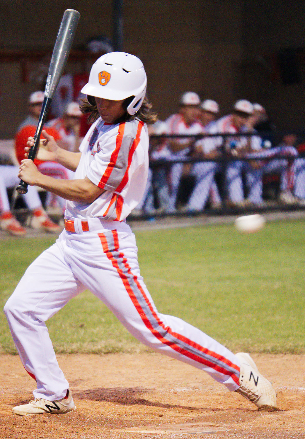 Riley Fowler tries to avoid an inside pitch but took one for the team and was awarded first base for Mineola.